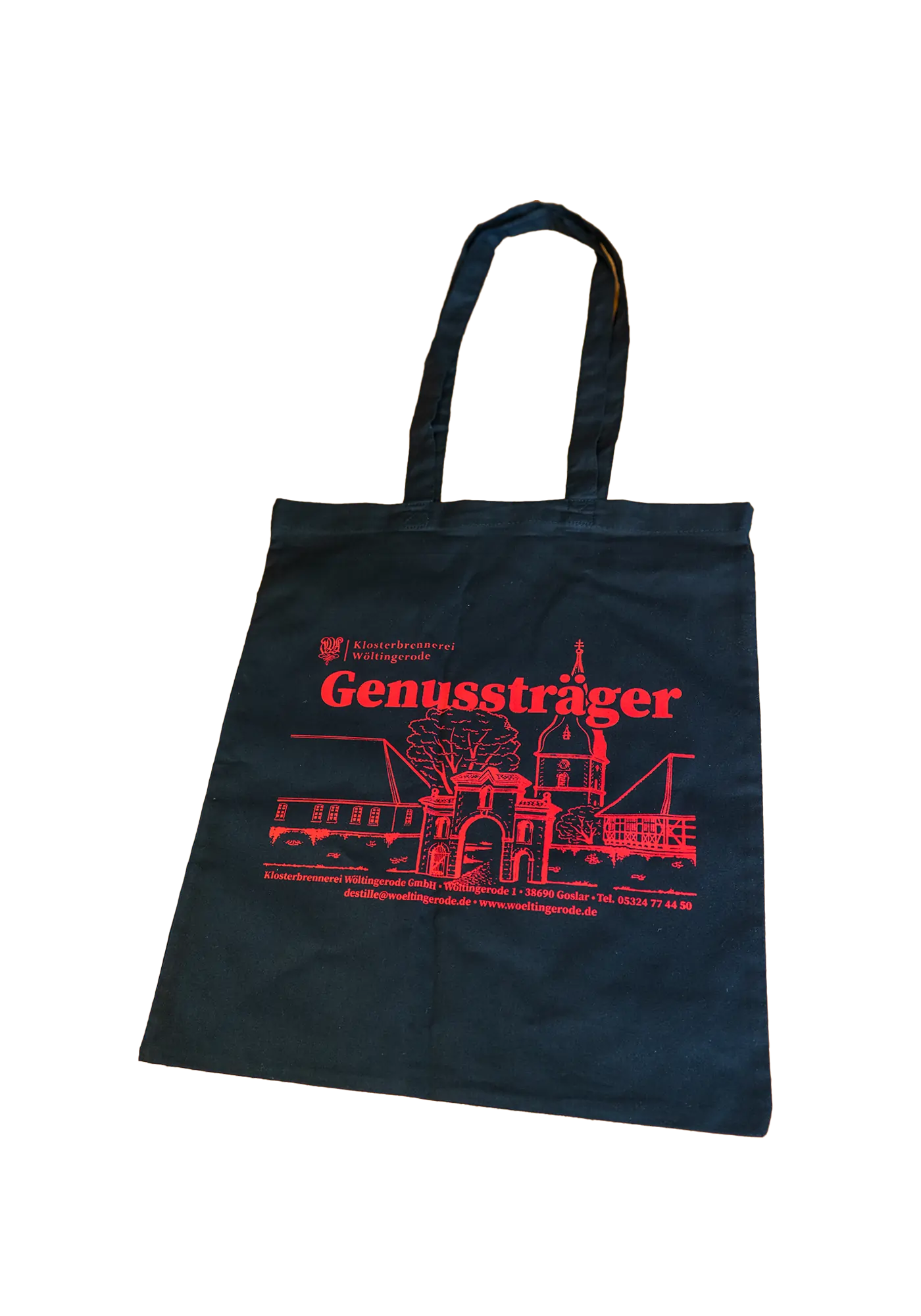 Vorderseite: Schwarze Baumwolltasche mit rotem Druck „Genussträger“ und Zeichnung des Klostertores Wöltingerode, lange Schulterhenkel.